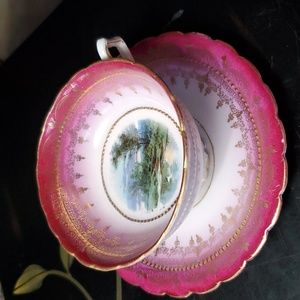 Vintage cup & saucer. Dark red with painted scene